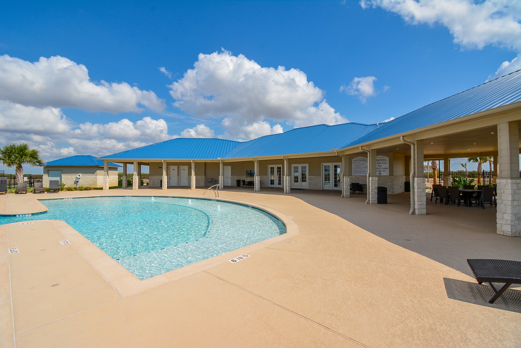 3036 Sandy Lane Palacios, TX 77465 - Photo 27 of 32 a front view of a house with swimming pool having outdoor seating
