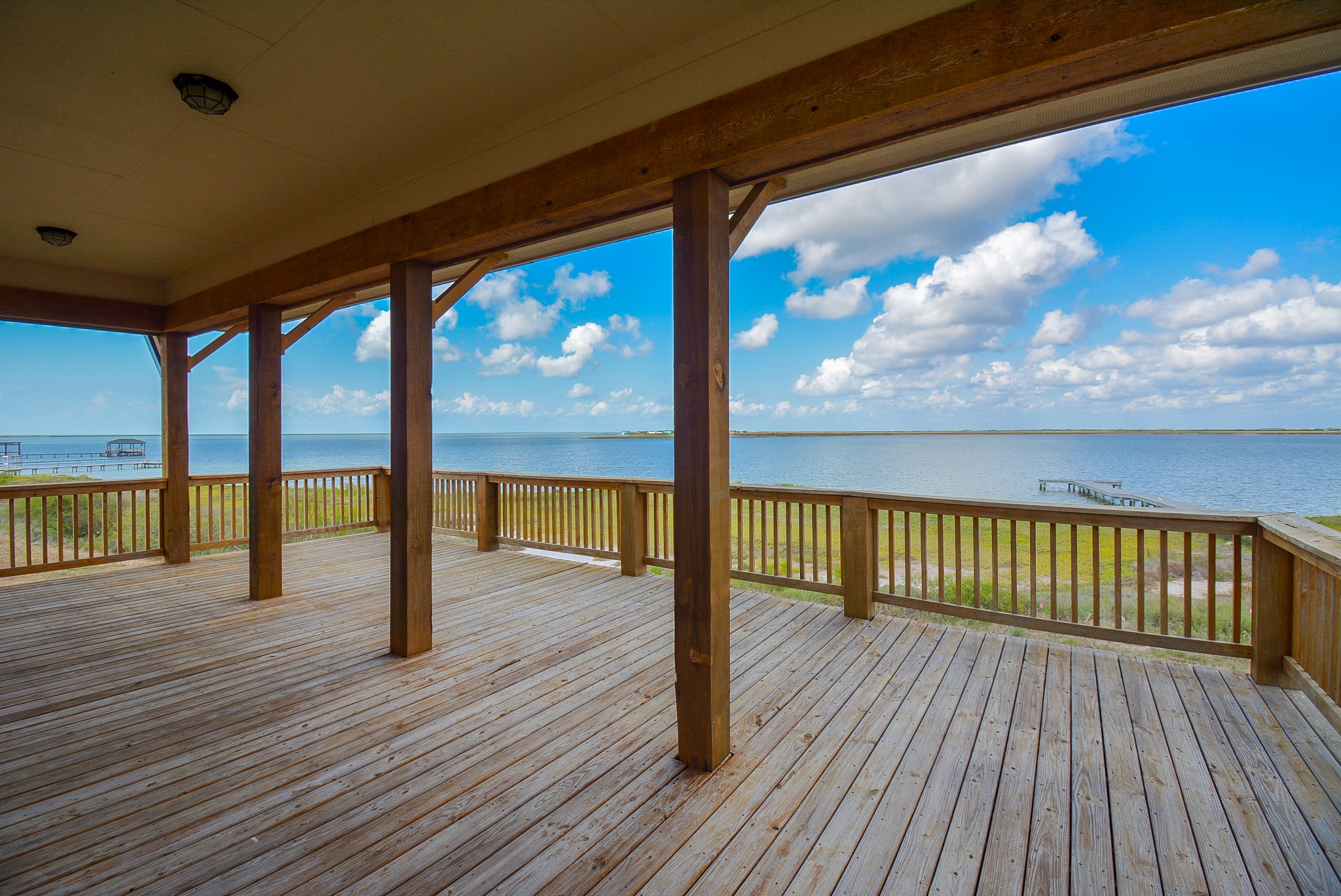3036 Sandy Lane Palacios, TX 77465 - Photo 8 of 32 a view of porch with wooden floor