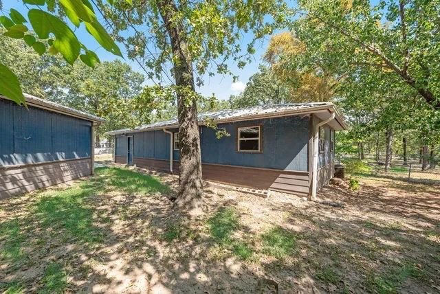 a backyard of a house with lots of green space