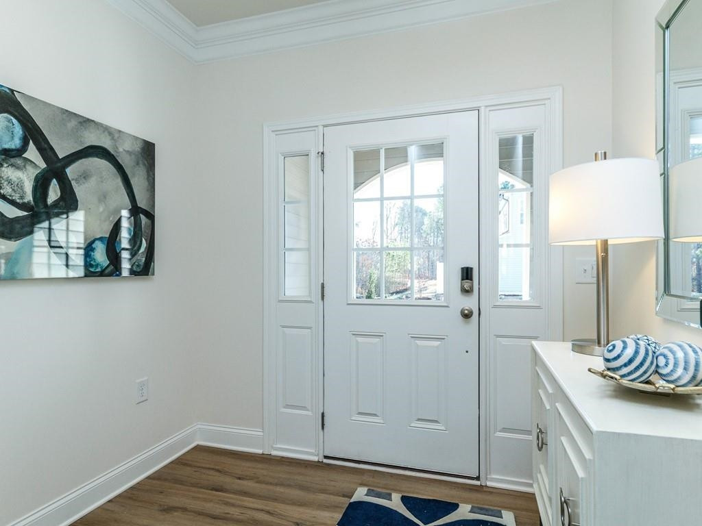 a view of a room that has a bed and a window in it