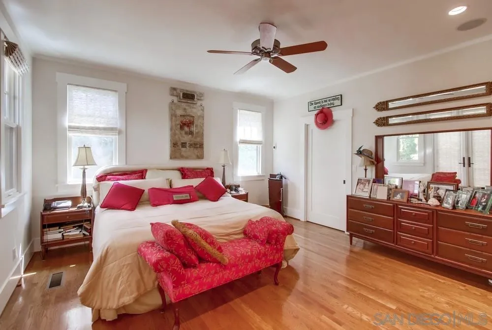 738 B Avenue Coronado, CA 92118 - Photo 16 of 25 a bedroom with a bed and wooden floor