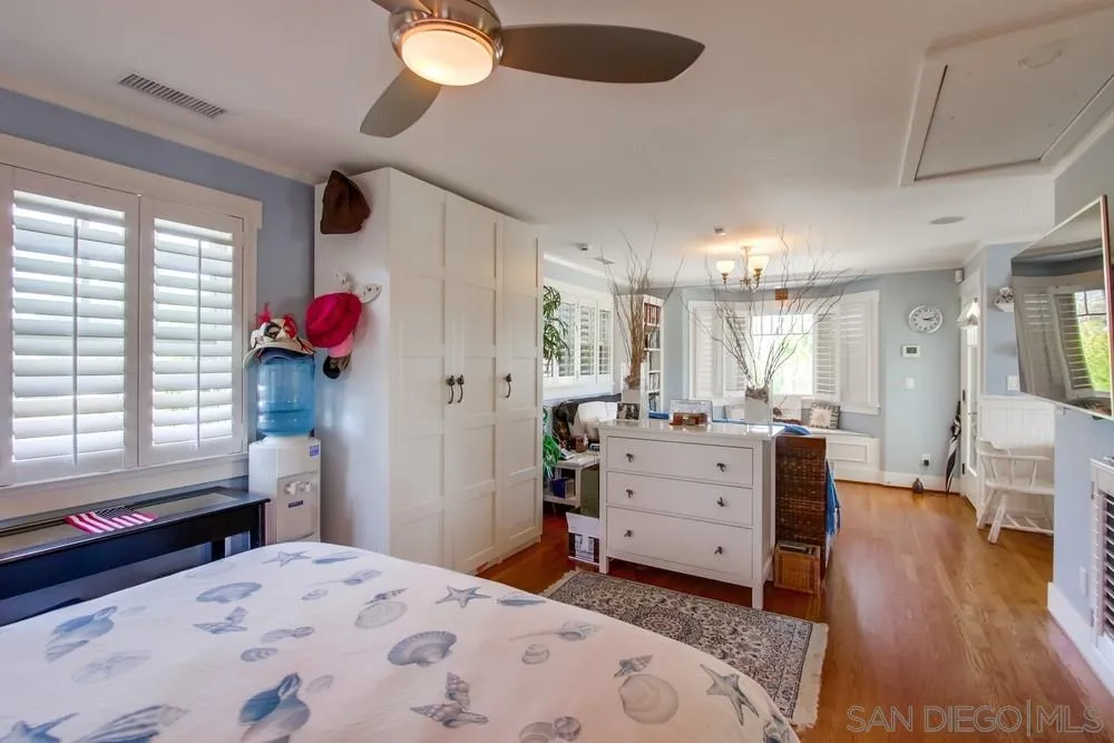 738 B Avenue Coronado, CA 92118 - Photo 22 of 25 a bed room with a bed window and a dresser
