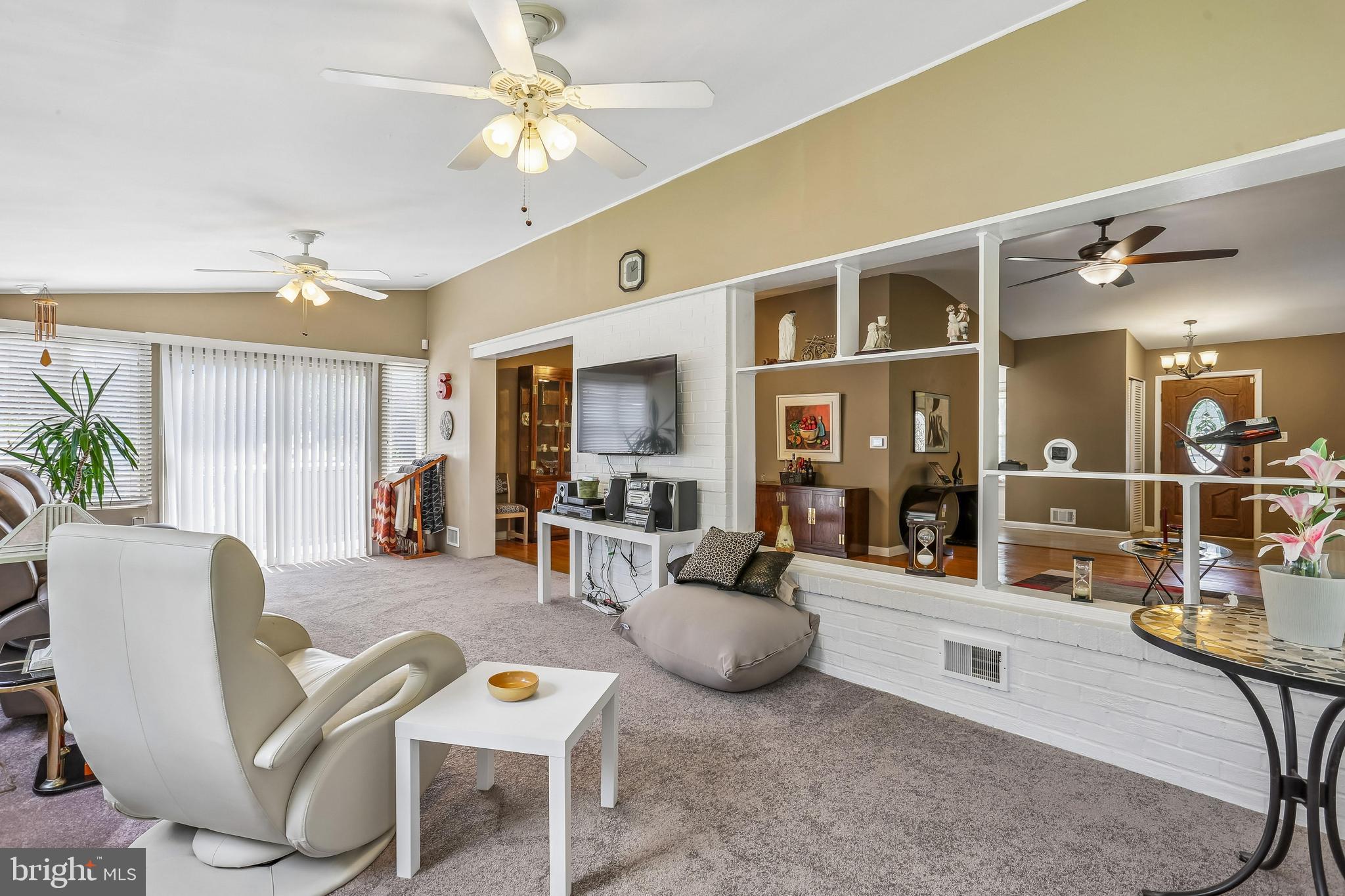 2 Foxhall Court Silver Spring, MD 20906 - Photo 29 of 86 a living room with furniture a chandelier and a dining table