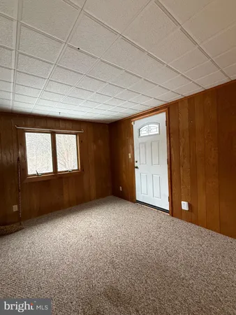 a bedroom with a bed and a table