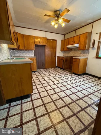 a kitchen with a sink and cabinets