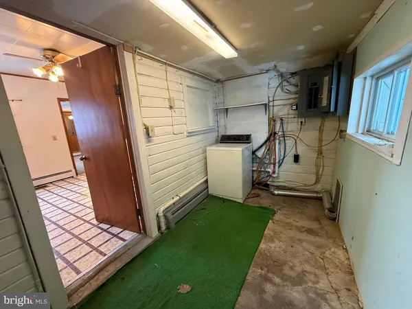 a kitchen with granite countertop a sink and cabinets