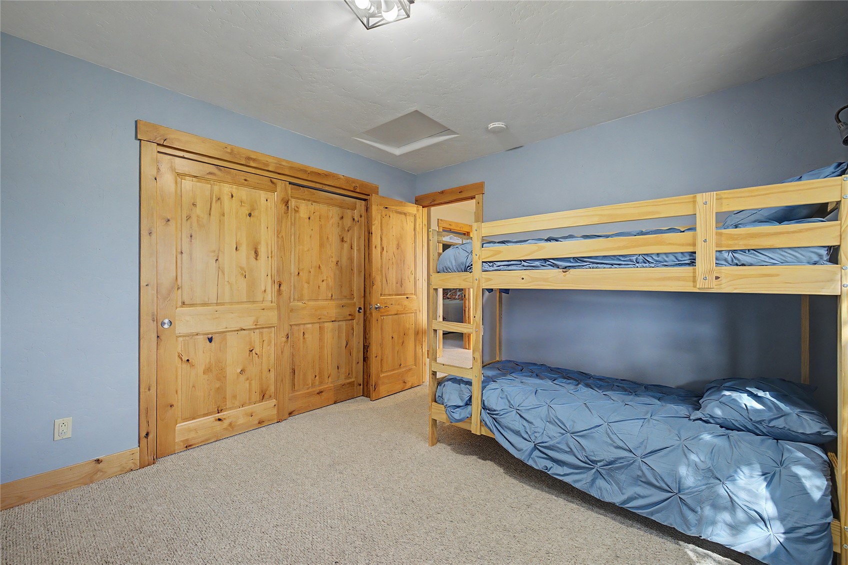 6726 Ryan Gulch Road, Unit 6726 Wildernest, CO 80498 - Photo 32 of 39 a room with a bed