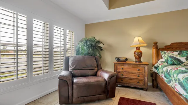 a bedroom with a bed and a dresser in it