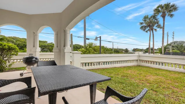 an aerial view of a house with yard swimming pool and outdoor seating