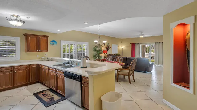 a open kitchen with stainless steel appliances granite countertop a sink and cabinets