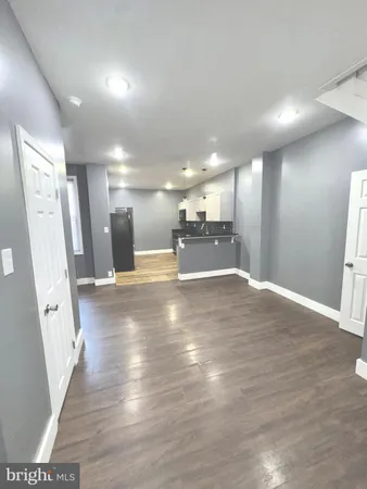 a view of a livingroom with wooden floor