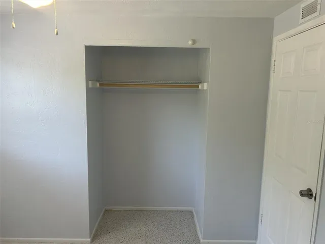 a view of an empty walk in closet