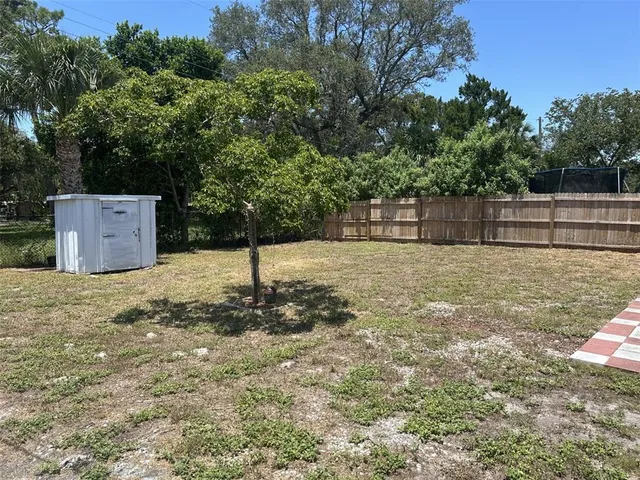 a backyard of a house with trees