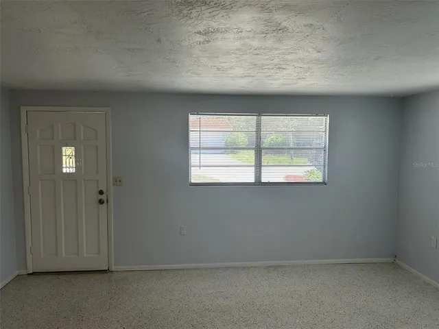 an empty room with windows