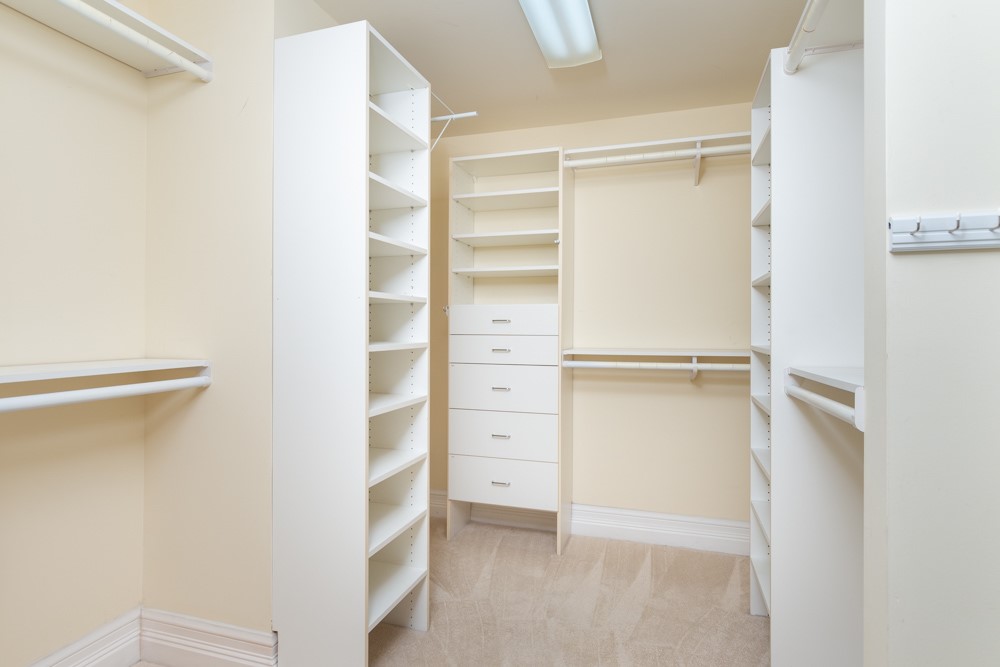 2240 Front Street, Unit 103 Melbourne, FL 32901 - Photo 17 of 31 a view of walk in closet with empty racks