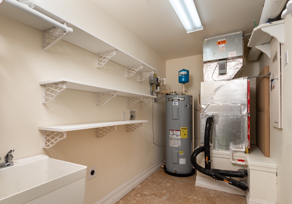 2240 Front Street, Unit 103 Melbourne, FL 32901 - Photo 25 of 31 a view of walk in closet with clothes and shoes