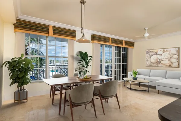 a living room with furniture and a potted plant