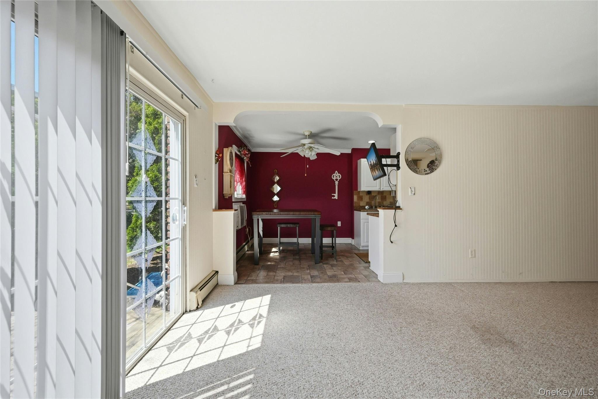 263 North Newbridge Road, Unit 1C Levittown, NY 11756 - Photo 4 of 19 a view of water heater room with window