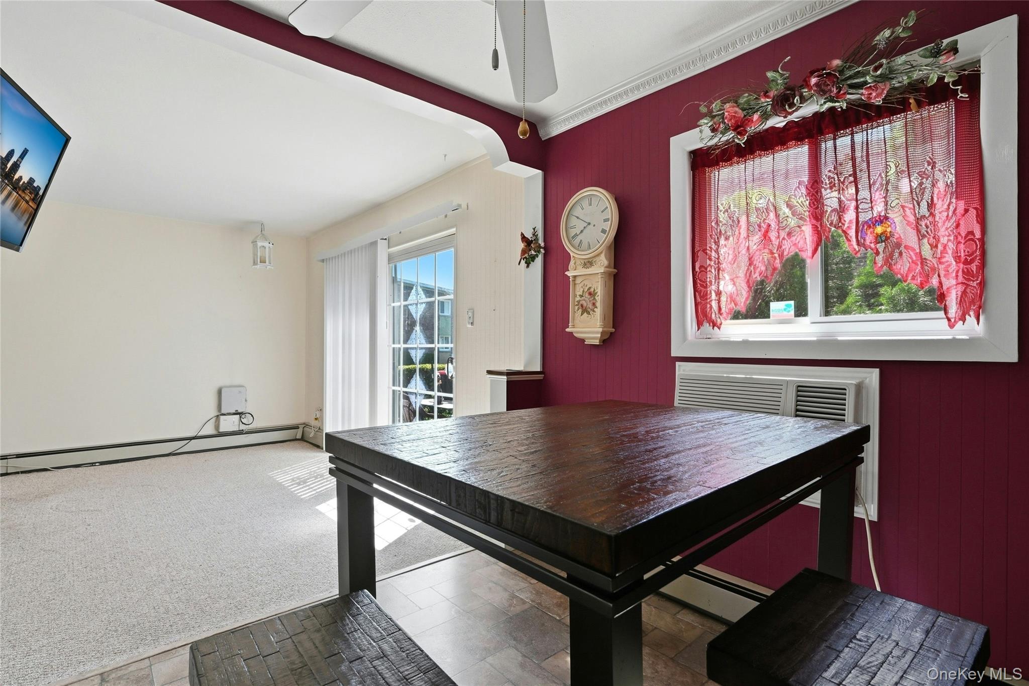 263 North Newbridge Road, Unit 1C Levittown, NY 11756 - Photo 6 of 19 a view of a room with a table and chairs