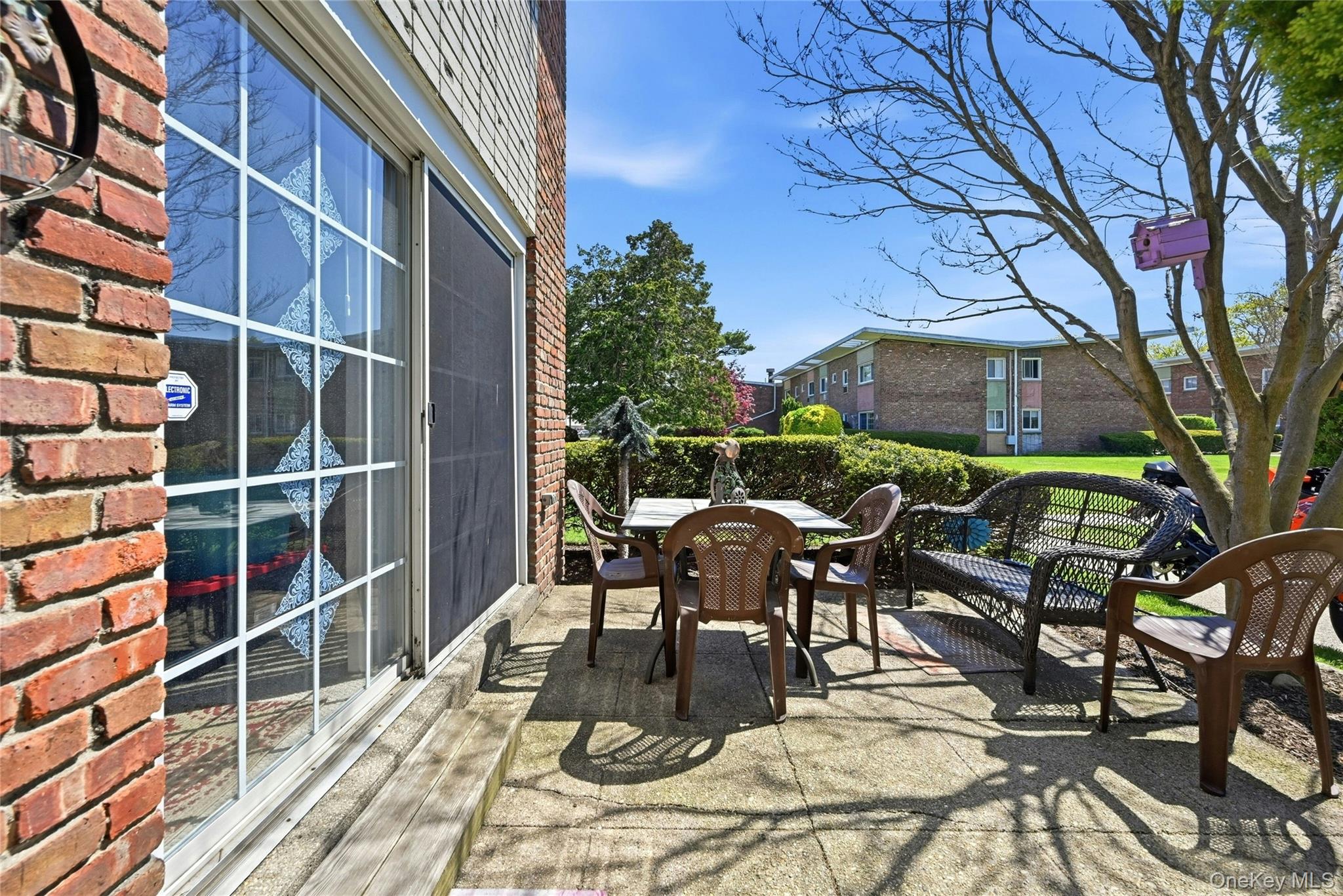263 North Newbridge Road, Unit 1C Levittown, NY 11756 - Photo 10 of 19 a view of a patio with iron fence