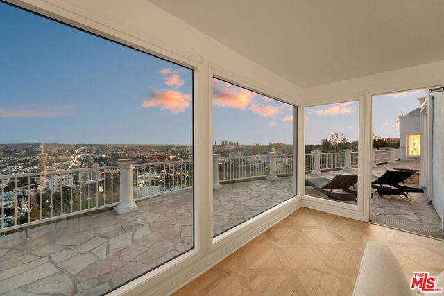 a view of a balcony with city view