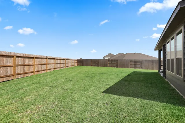 an aerial view of a swimming pool and outdoor space