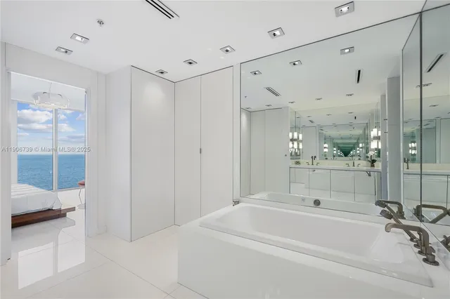 a bathroom with a toilet and shower