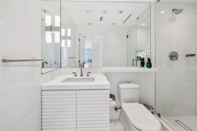 a living room with furniture and large windows