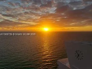 a building outdoor space with patio furniture and potted plants
