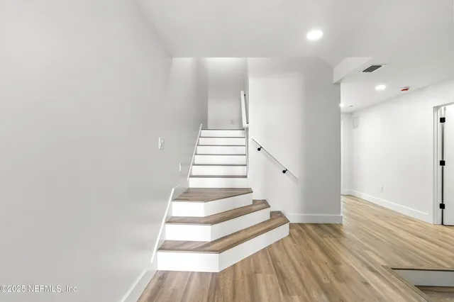 a view of swimming pool from a balcony