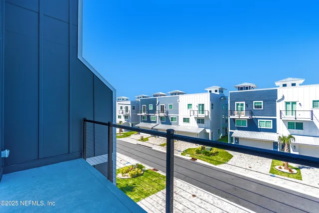 a bathroom with a shower and a glass door