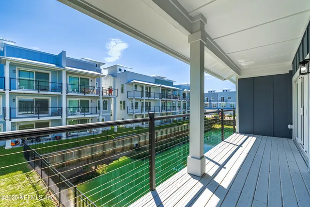 a view of a balcony with a swimming pool