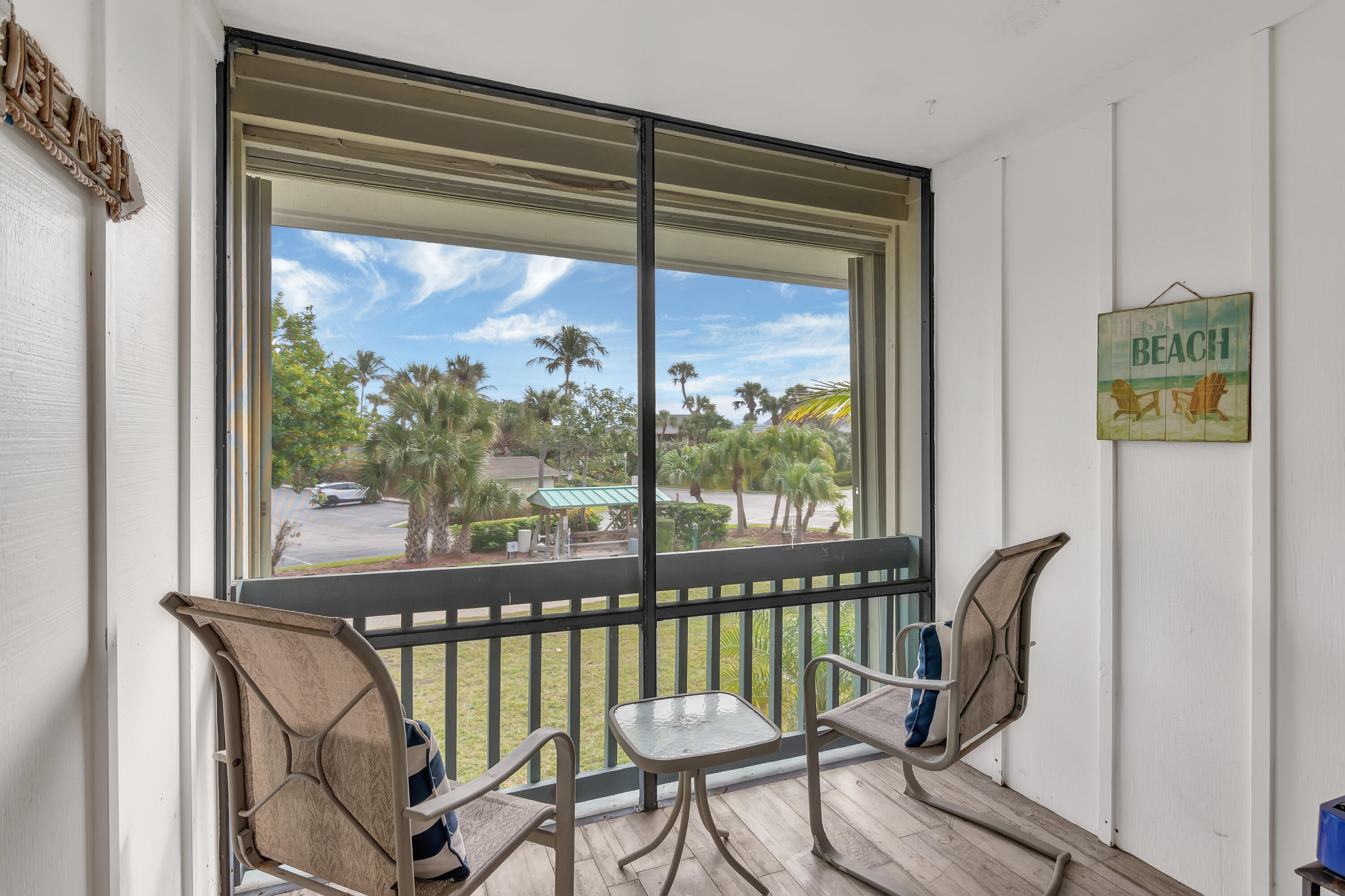 2400 South Ocean Drive, Unit 1122 Fort Pierce, FL 34949 - Photo 12 of 18 a view of a balcony with chair and a potted plant