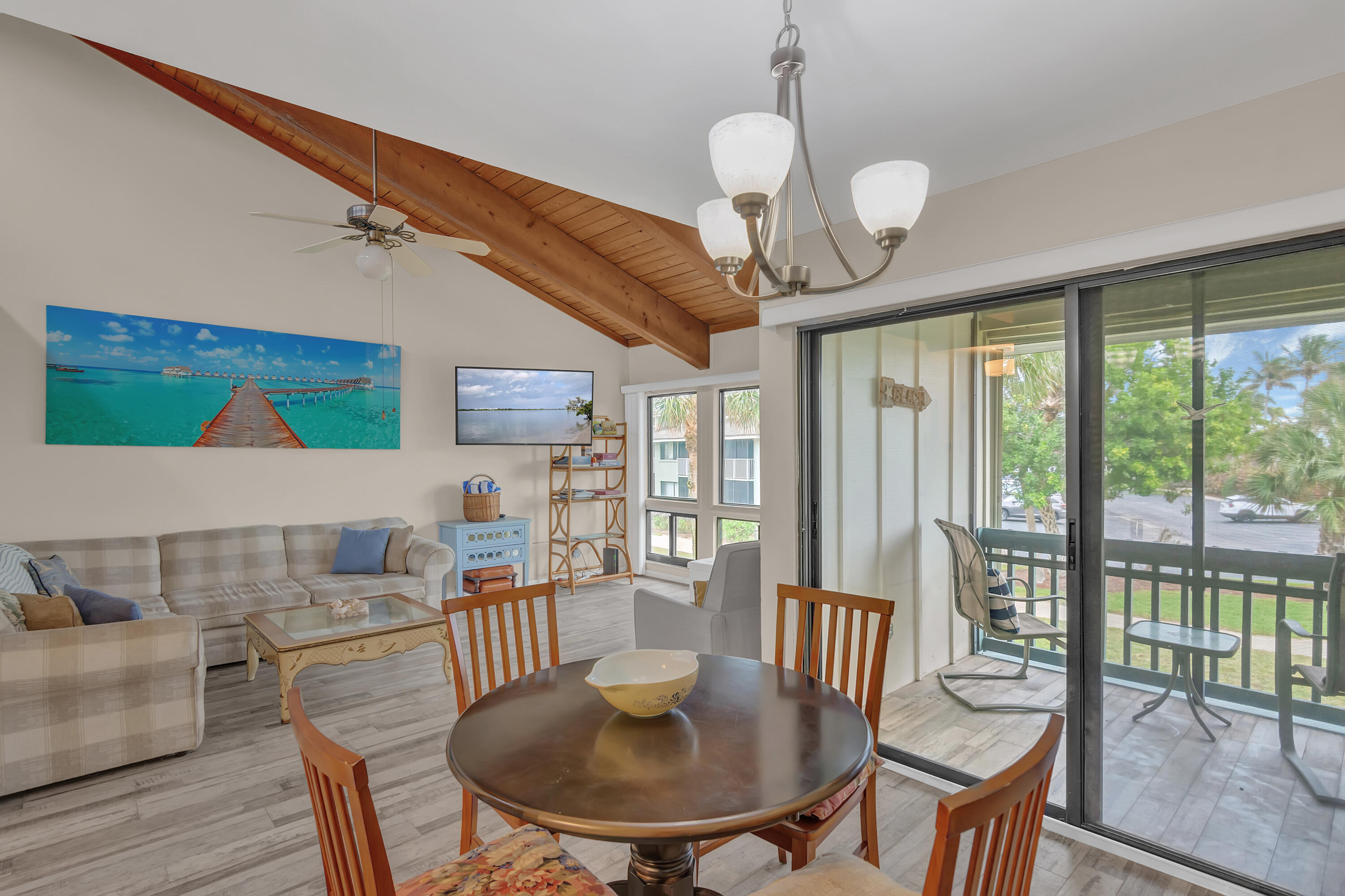 2400 South Ocean Drive, Unit 1122 Fort Pierce, FL 34949 - Photo 2 of 18 a view of a dining room with furniture wooden floor and chandelier