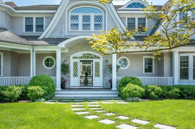 a front view of a house with a yard