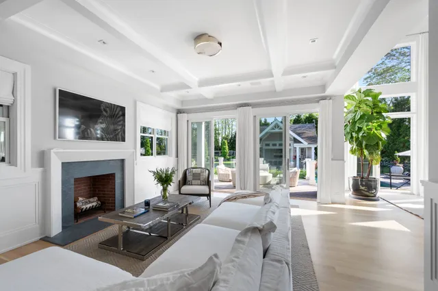 a living room with furniture fireplace and flat screen tv