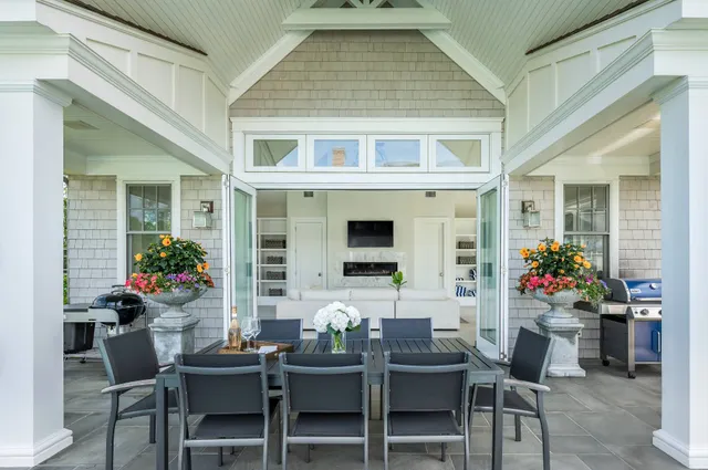 a view of a dining room and chairs and table in a patio