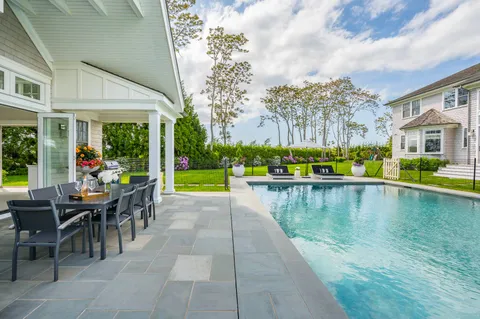 a view of a swimming pool with a patio