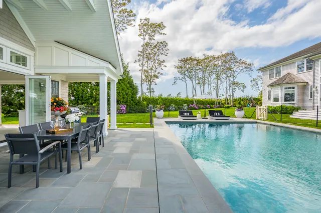 a view of a swimming pool with a patio