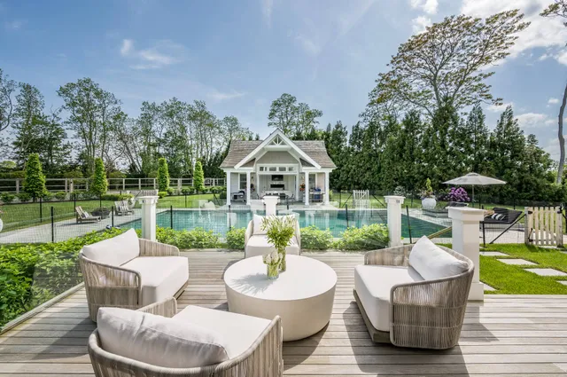 a view of a patio with couches chairs and a yard