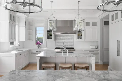 a kitchen with a sink cabinets and window