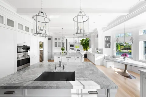 a view of a living room and kitchen