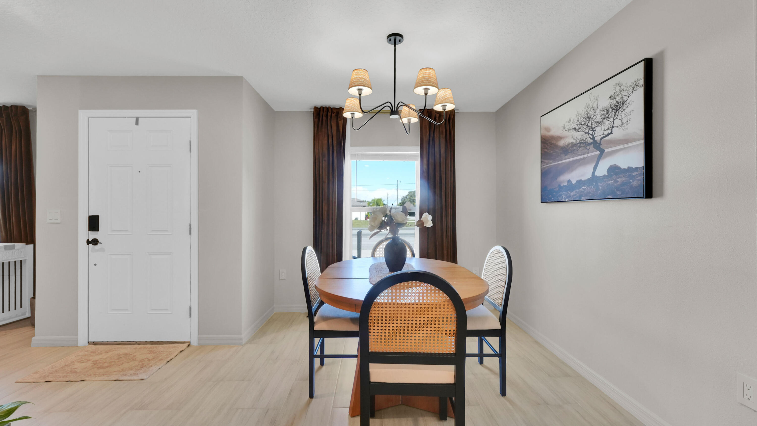 1382 Southwest Becker Road Port St. Lucie, FL 34953 - Photo 13 of 56 a dining room with furniture and chandelier
