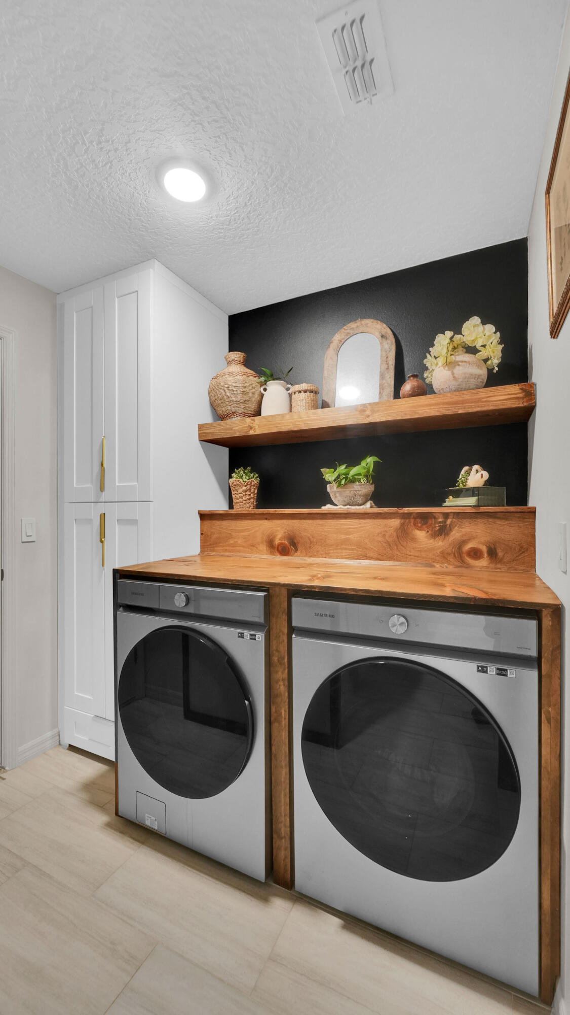 1382 Southwest Becker Road Port St. Lucie, FL 34953 - Photo 23 of 56 a utility room with dryer and washer
