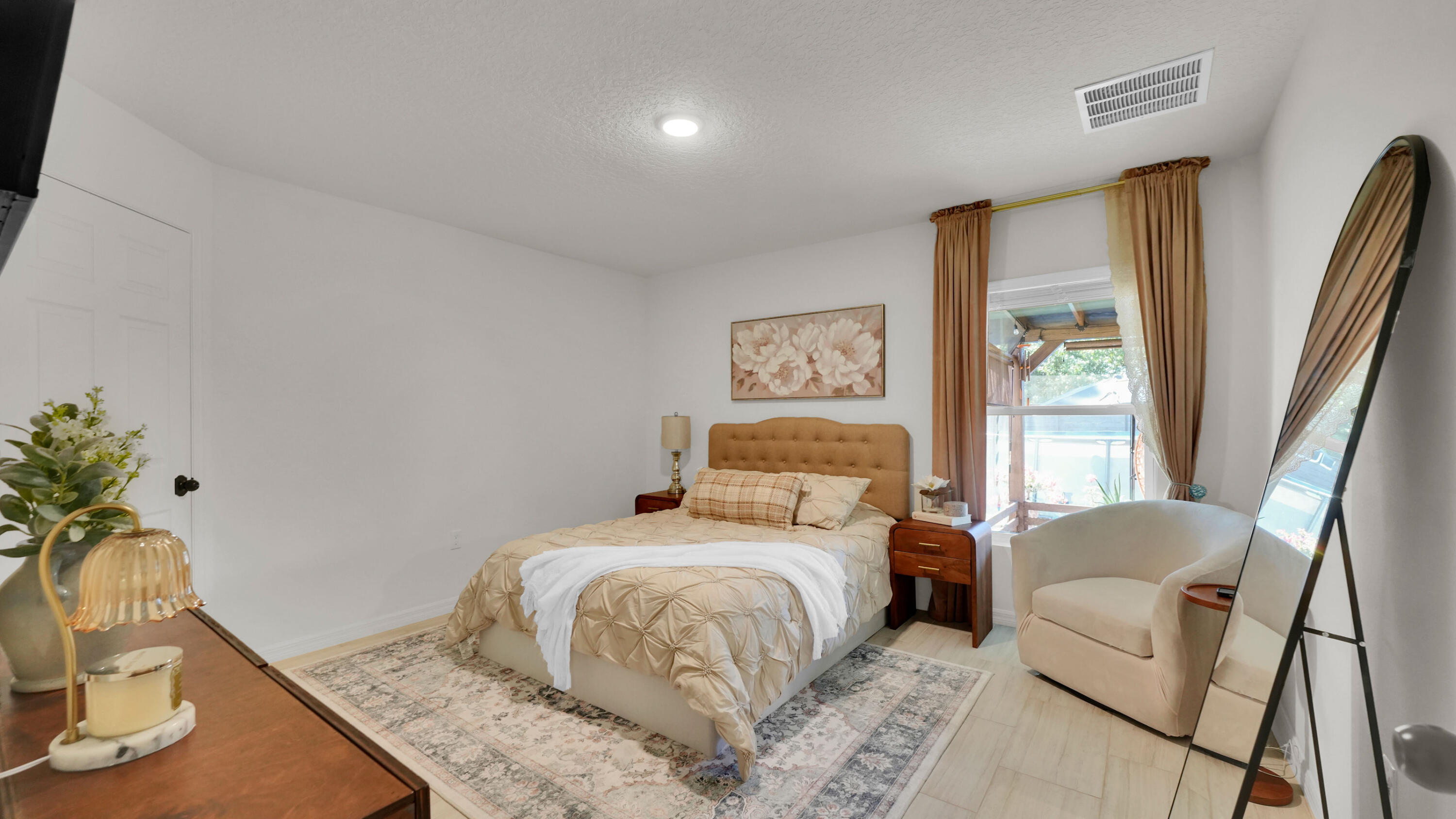 1382 Southwest Becker Road Port St. Lucie, FL 34953 - Photo 24 of 56 a bedroom with a bed and wooden floor