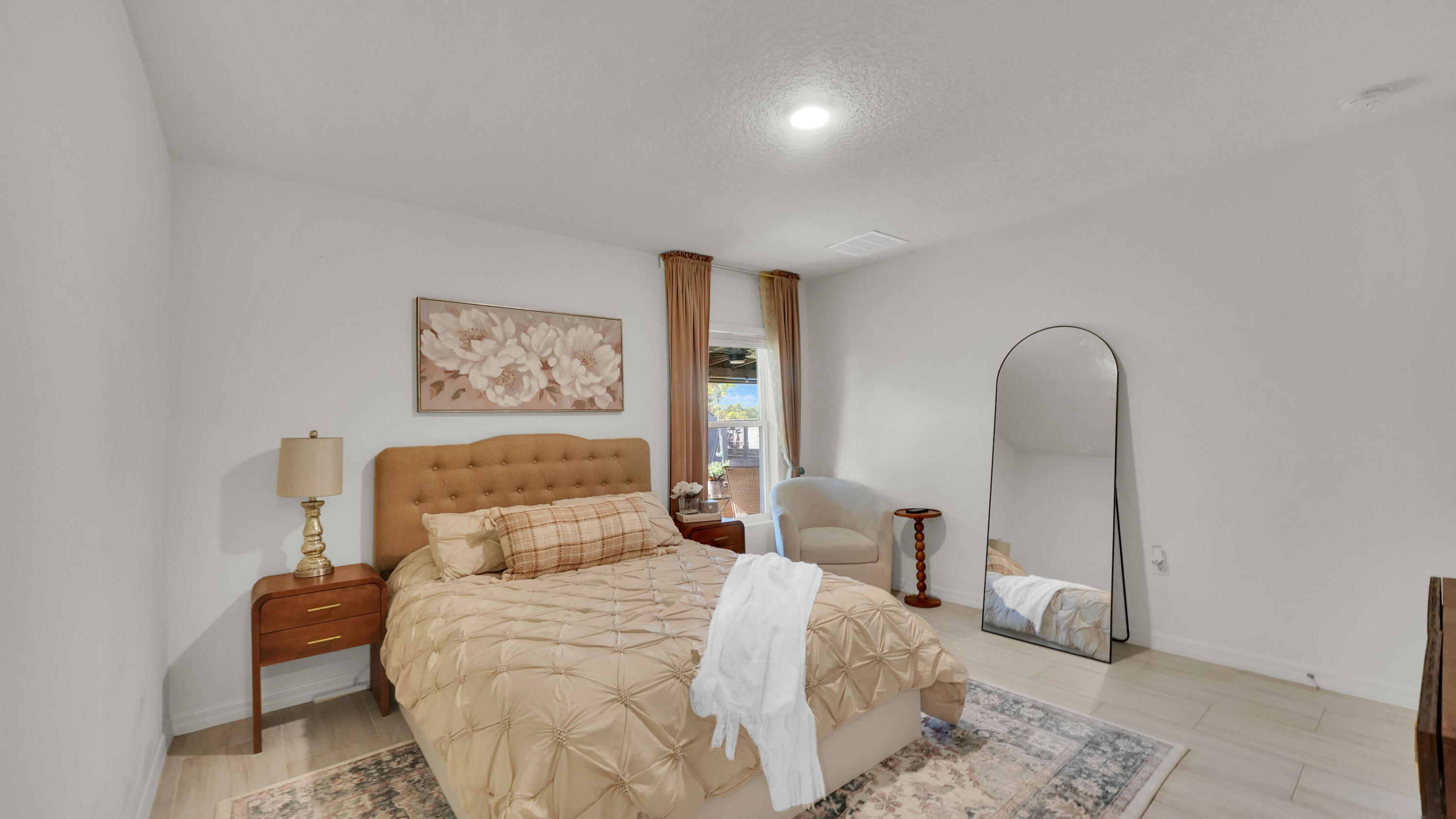 1382 Southwest Becker Road Port St. Lucie, FL 34953 - Photo 25 of 56 a bedroom with a bed and a painting on the wall