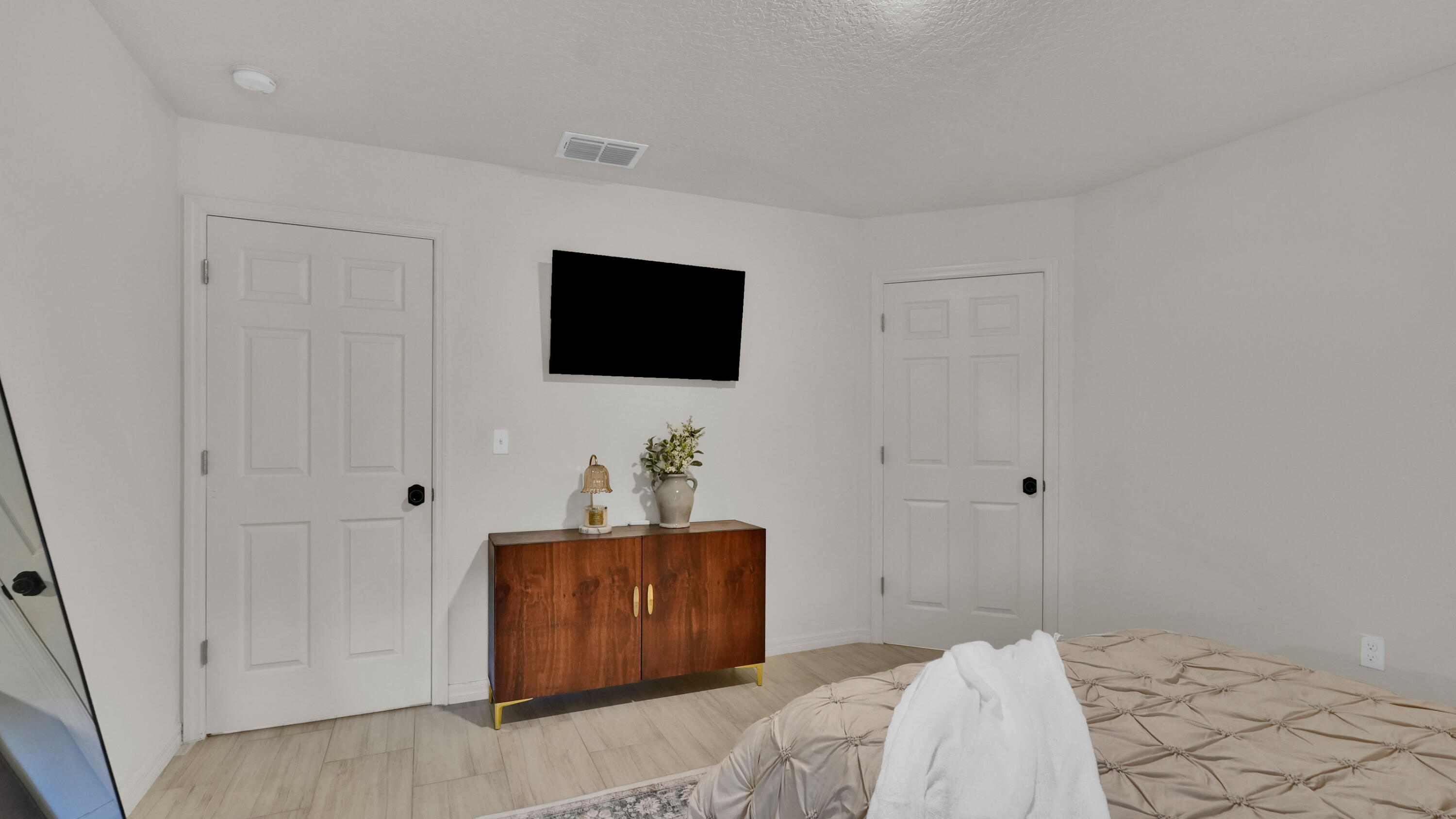 1382 Southwest Becker Road Port St. Lucie, FL 34953 - Photo 26 of 56 a bedroom with a bed and a flat screen tv