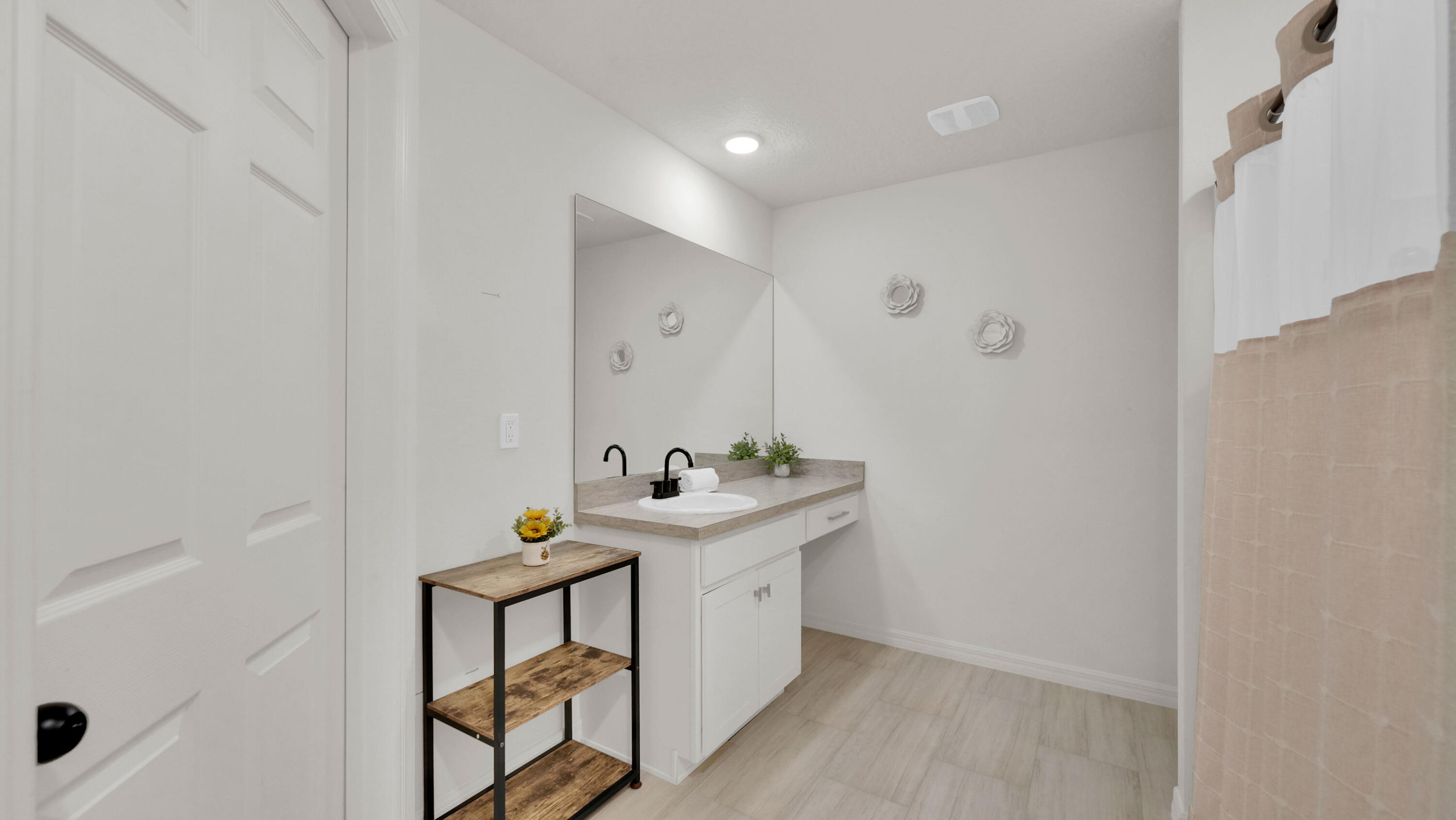 1382 Southwest Becker Road Port St. Lucie, FL 34953 - Photo 28 of 56 a bathroom with a sink a toilet and mirror