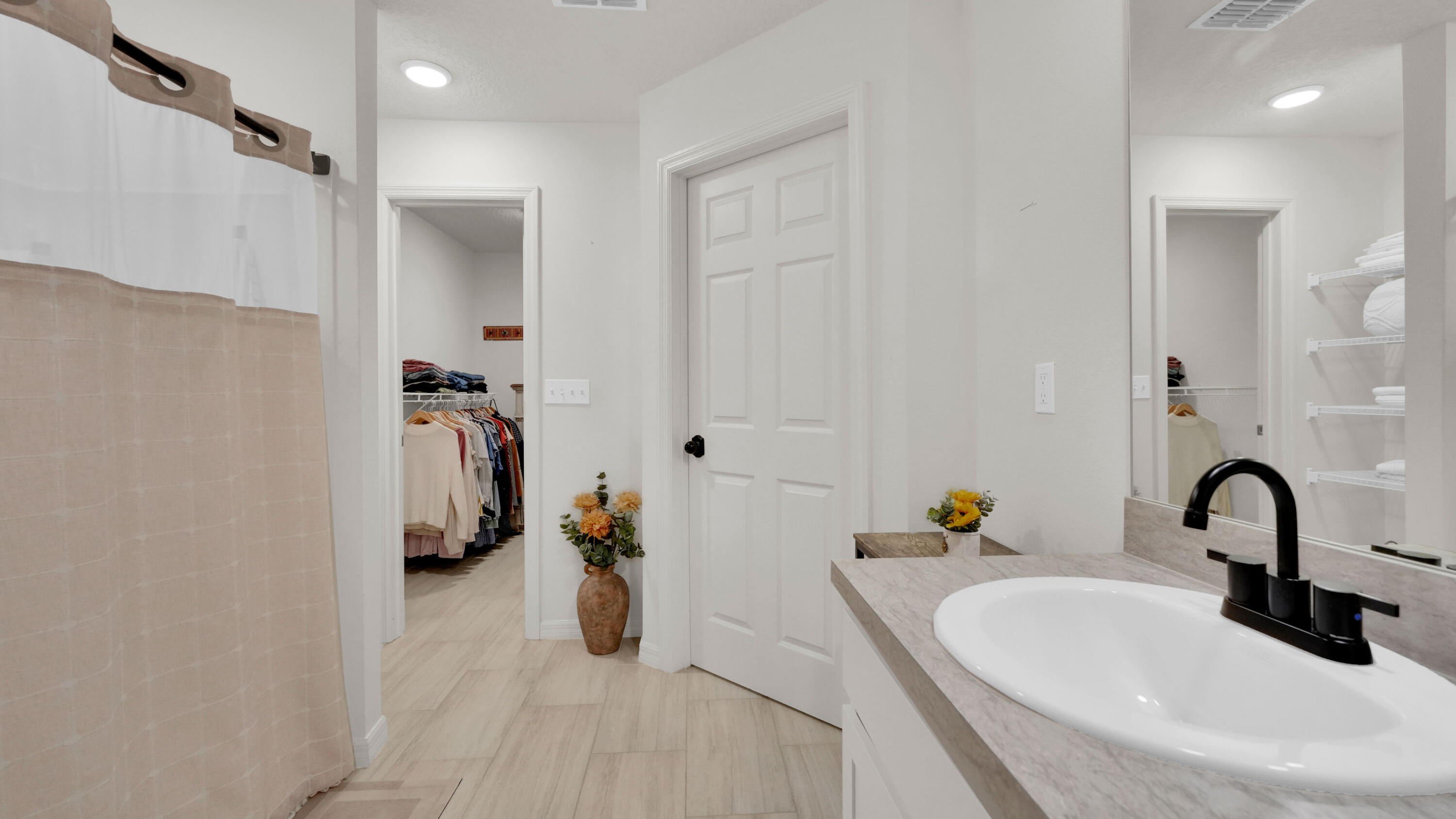 1382 Southwest Becker Road Port St. Lucie, FL 34953 - Photo 29 of 56 a bathroom with a sink and a mirror