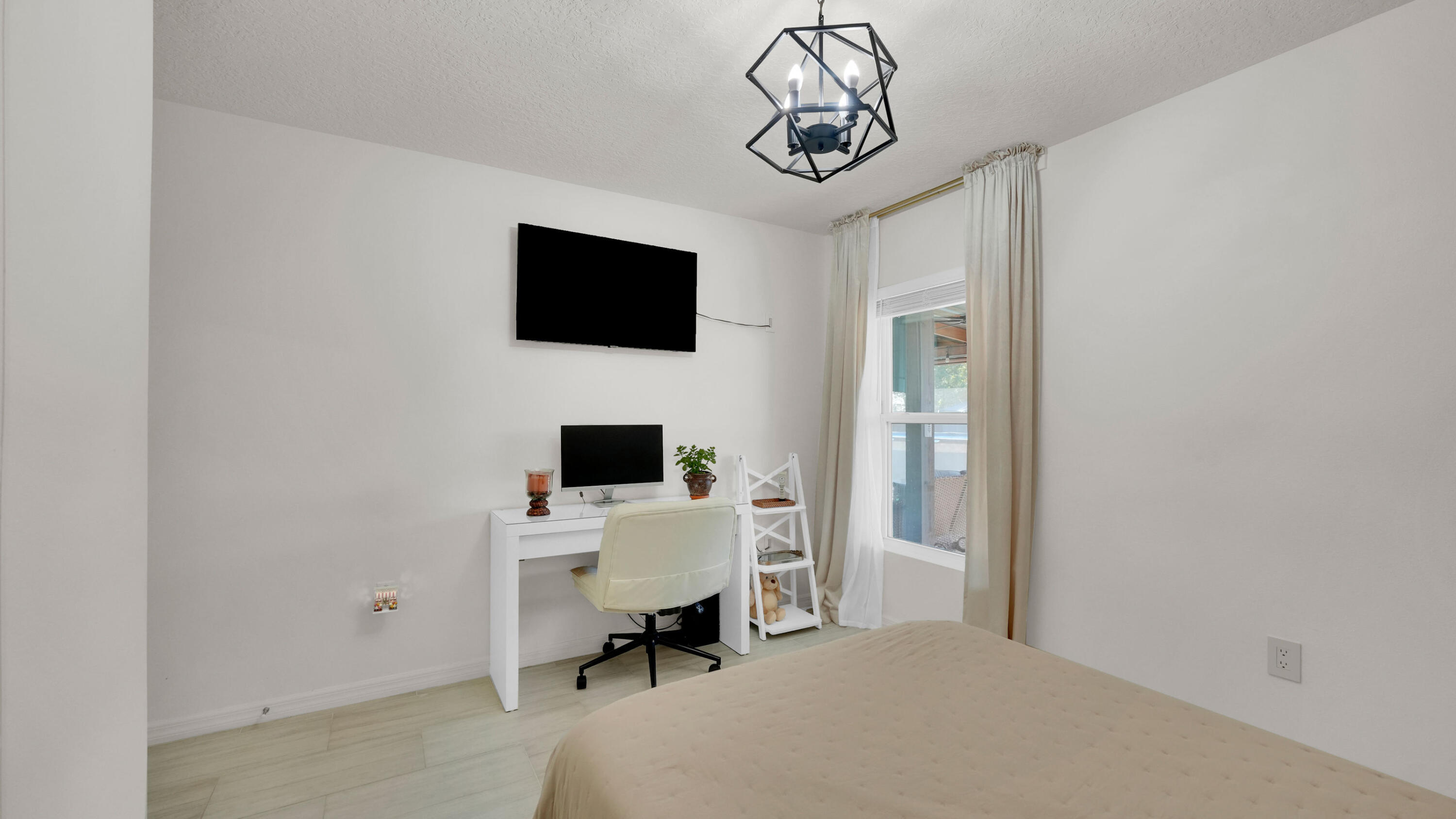 1382 Southwest Becker Road Port St. Lucie, FL 34953 - Photo 33 of 56 a view of a livingroom with a flat screen tv